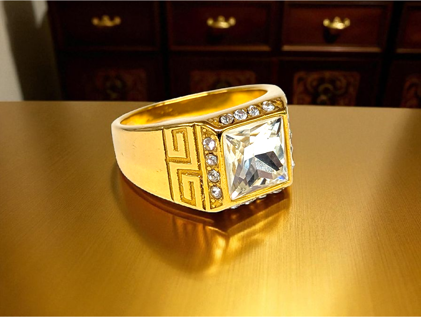 Olympian Brilliance: Gold Ring with Square-Cut Gemstone