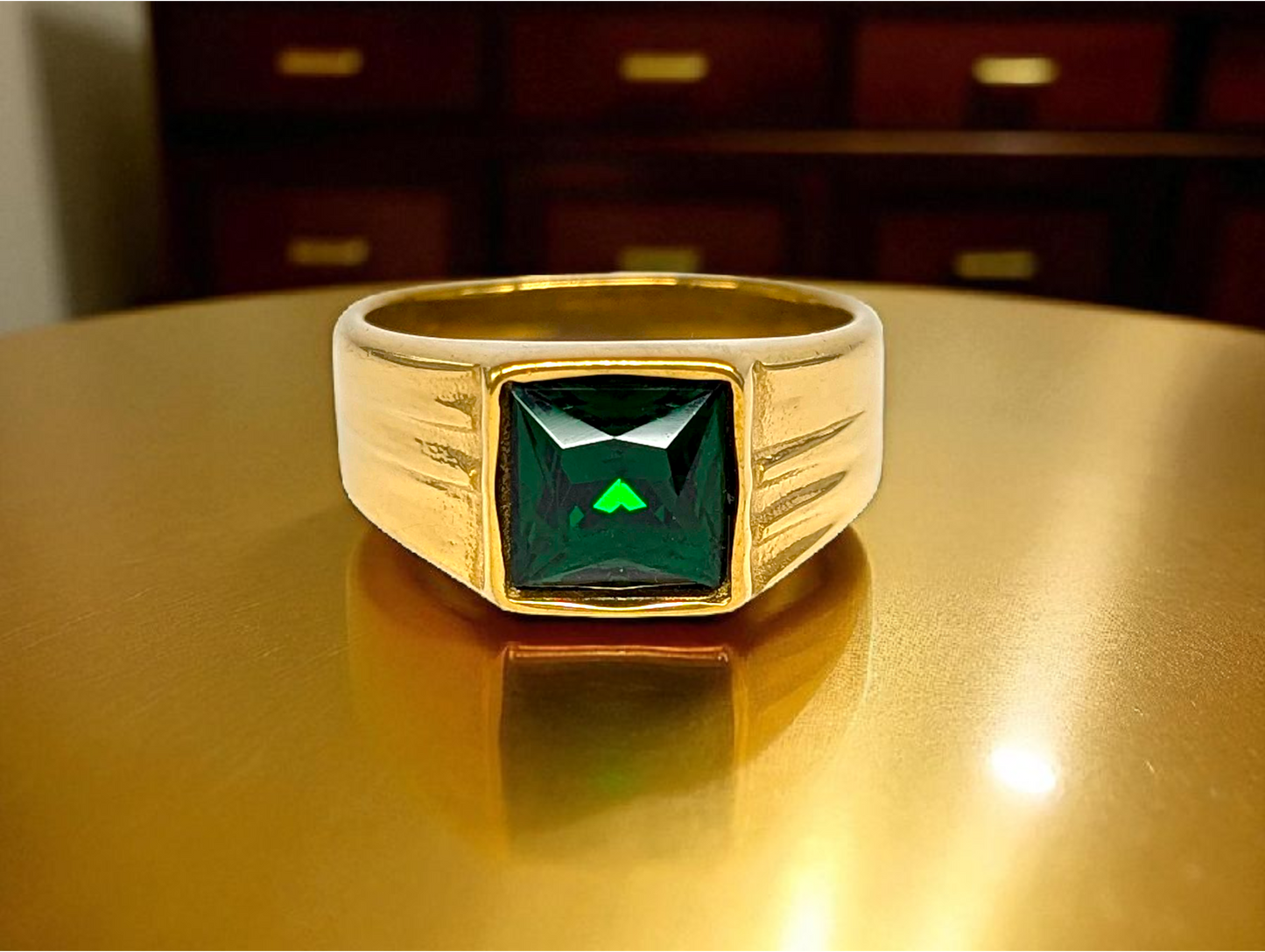 Emerald Elegance: Gold Ring with Rectangular Green Gemstone