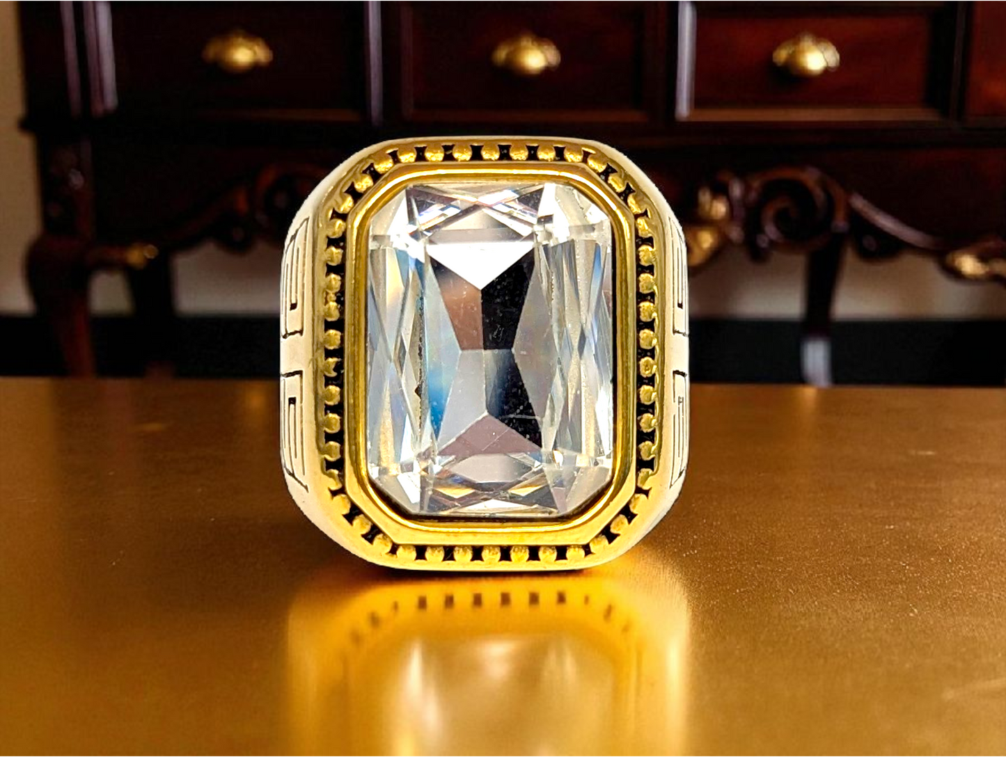 Majestic Maze: Gold Ring with Clear Gemstone & Geometric Engraving