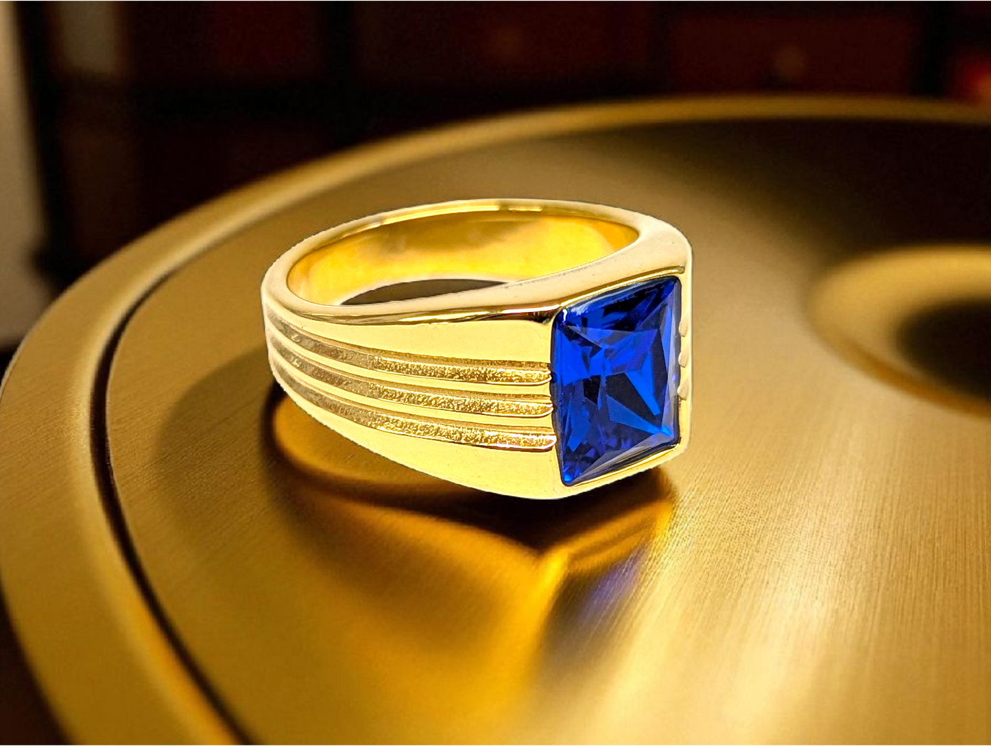 Sapphire Precision: Gold Ring with Square Blue Gemstone & Grooved Band