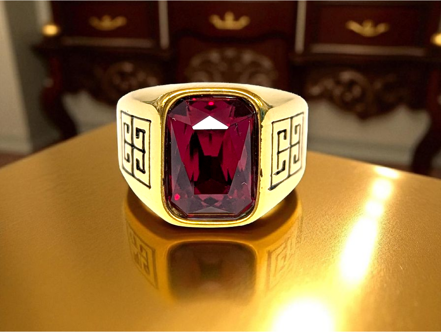 Crimson Majesty: Gold Ring with Red Gemstone & Geometric Detailing