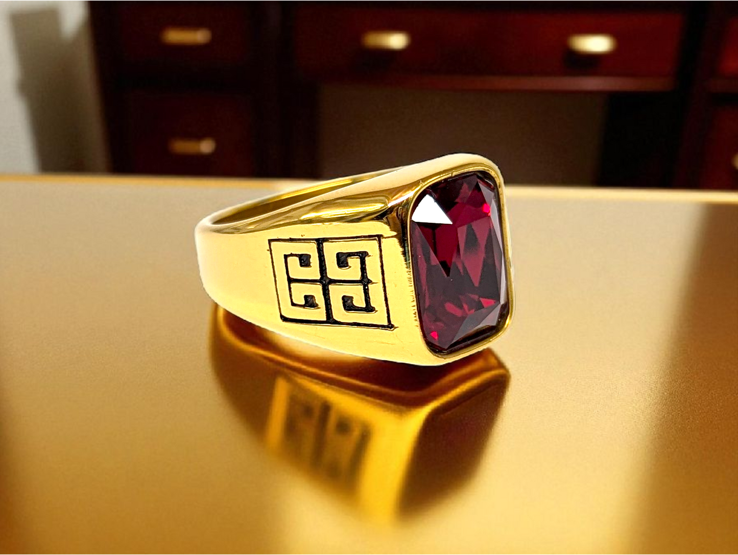 Crimson Majesty: Gold Ring with Red Gemstone & Geometric Detailing