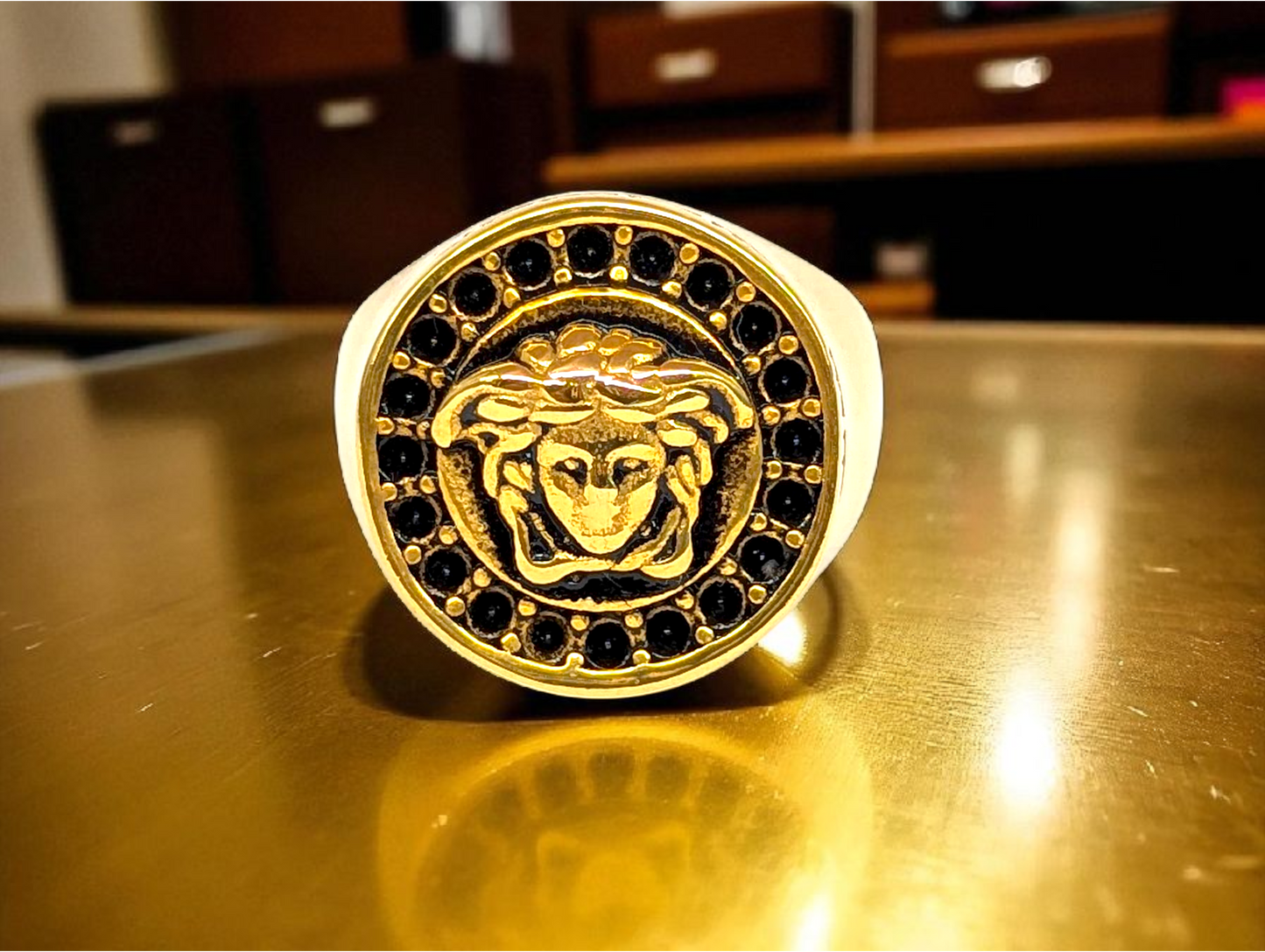 Mythic Elegance: Gold-Tone Ring with Embossed Head & Greek Key Border