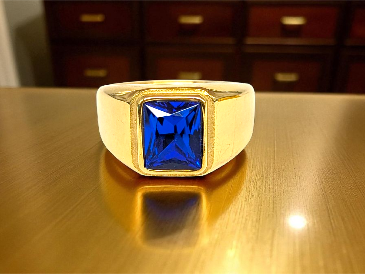 Sapphire Bold: Gold Ring with Blue Gemstone